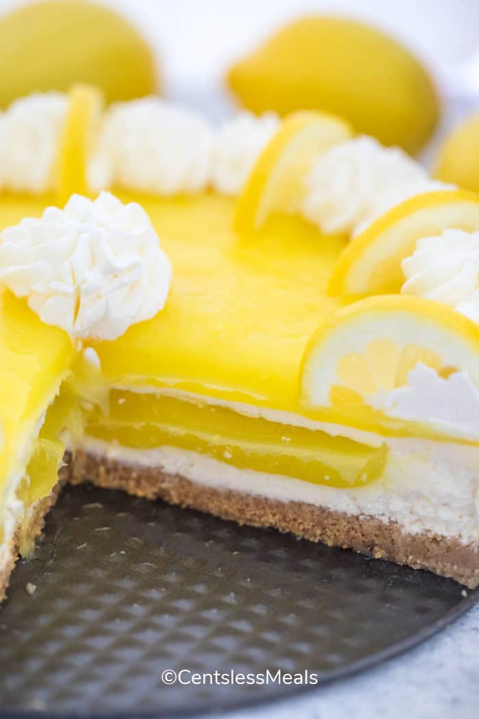 Lemon Cheesecake on a plate with a slice taken out