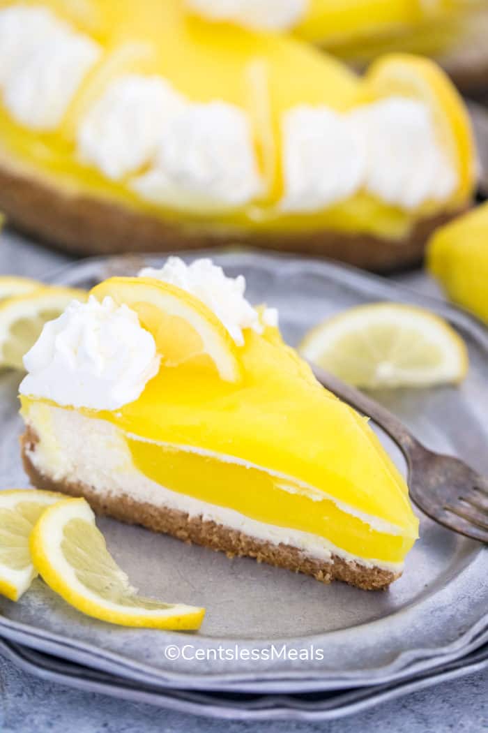 piece of Lemon Cheesecake on a plate with a fork