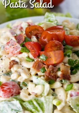 BLT Pasta Salad garnished with tomatoes and served in a white bowl