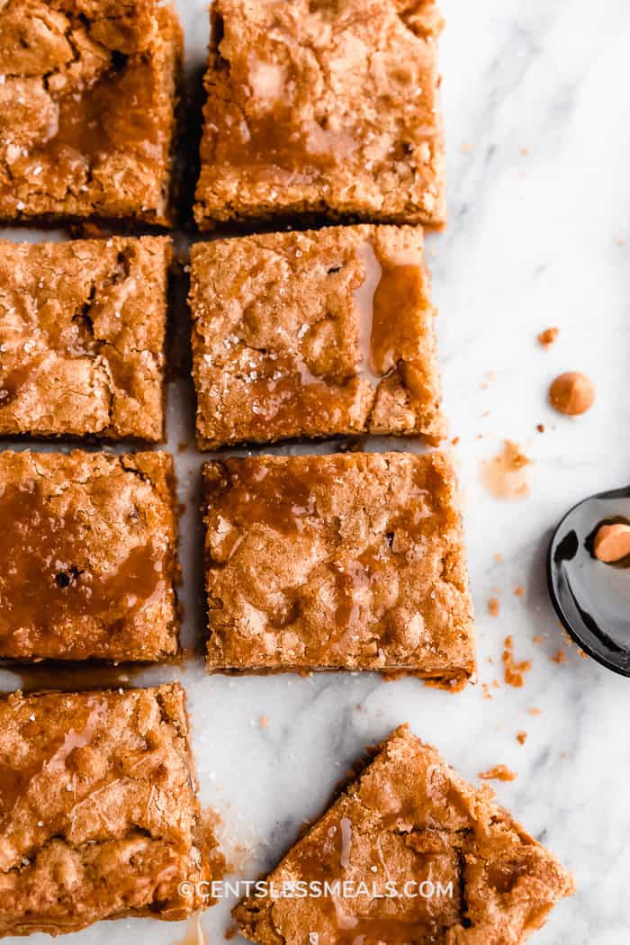 Butterscotch Blondies cut into squares resting on a marble countertop