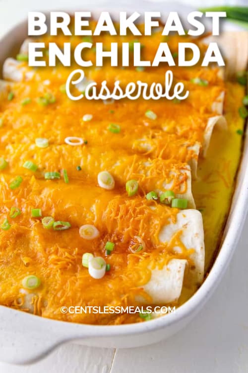 Breakfast Enchiladas baked in a white casserole dish with a title