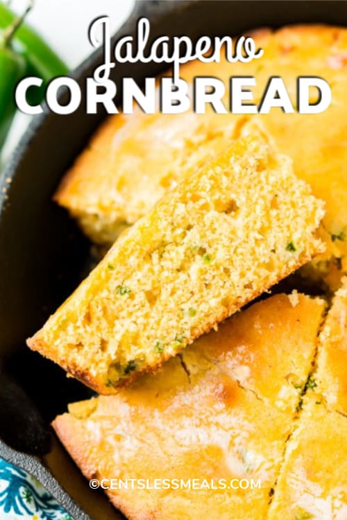 Wedges of Jalapeño Cornbread cut out of a skillet with writing