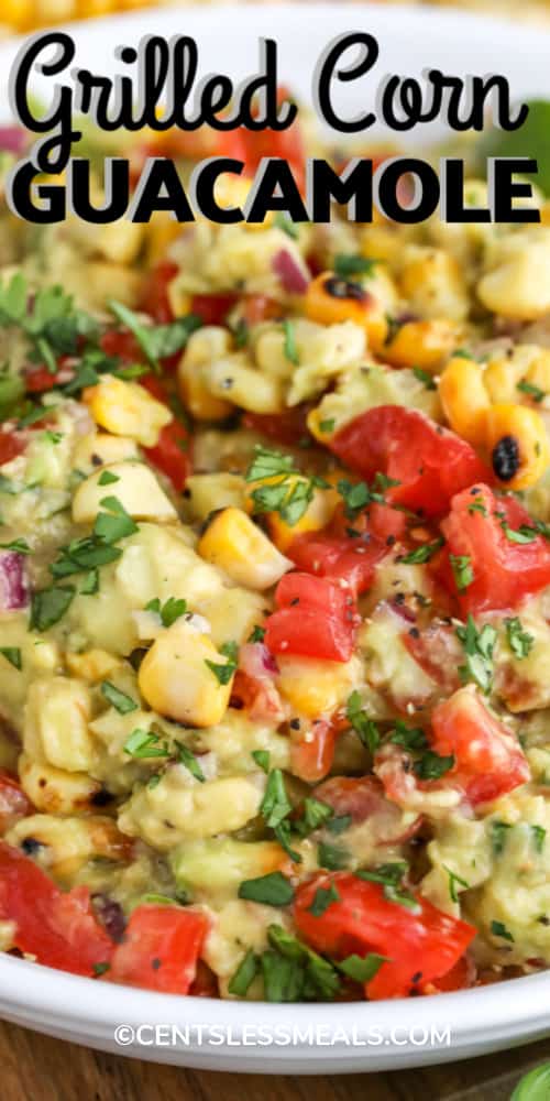 Grilled Corn Guacamole in a white bowl, garnished with cilantro with a title.