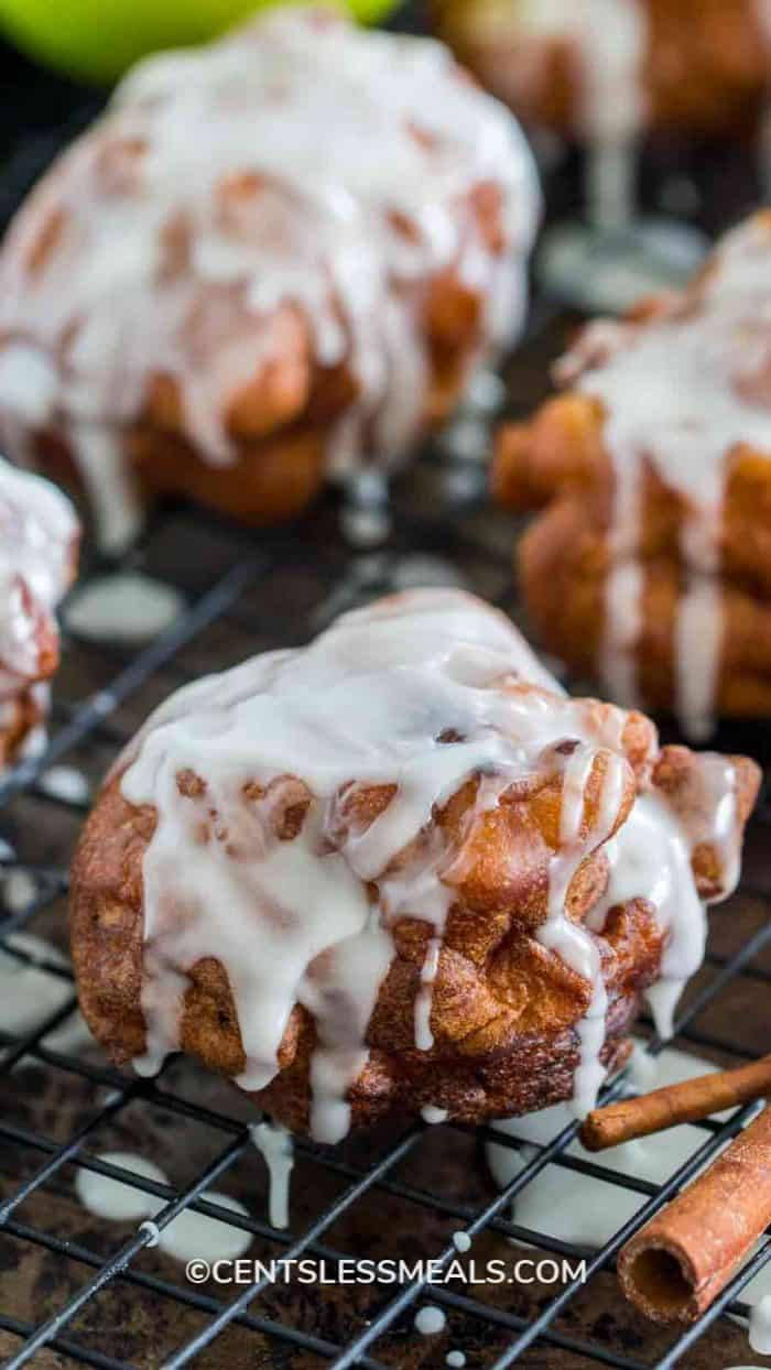 Glazed Apple Fritters on a wire cooling rack
