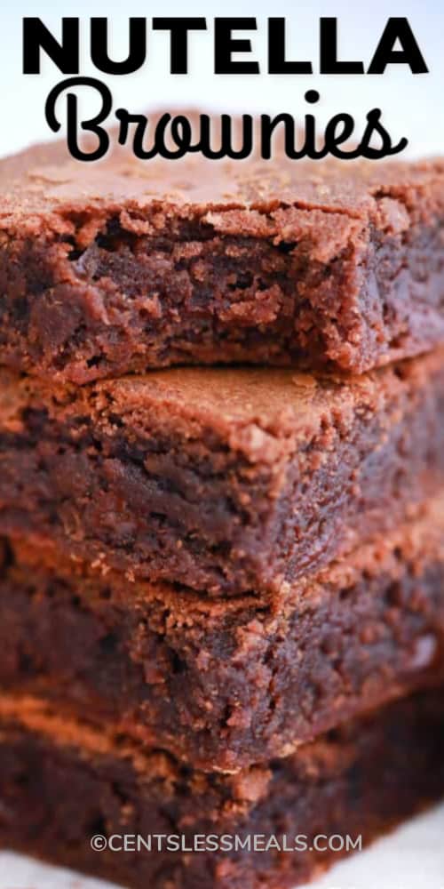 Nutella Brownies stacked on top of each other with a writing.