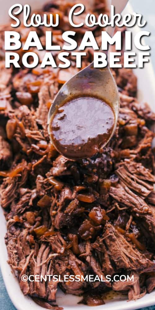 Slow Cooker Balsamic Roast Beef served on a white plate with writing.