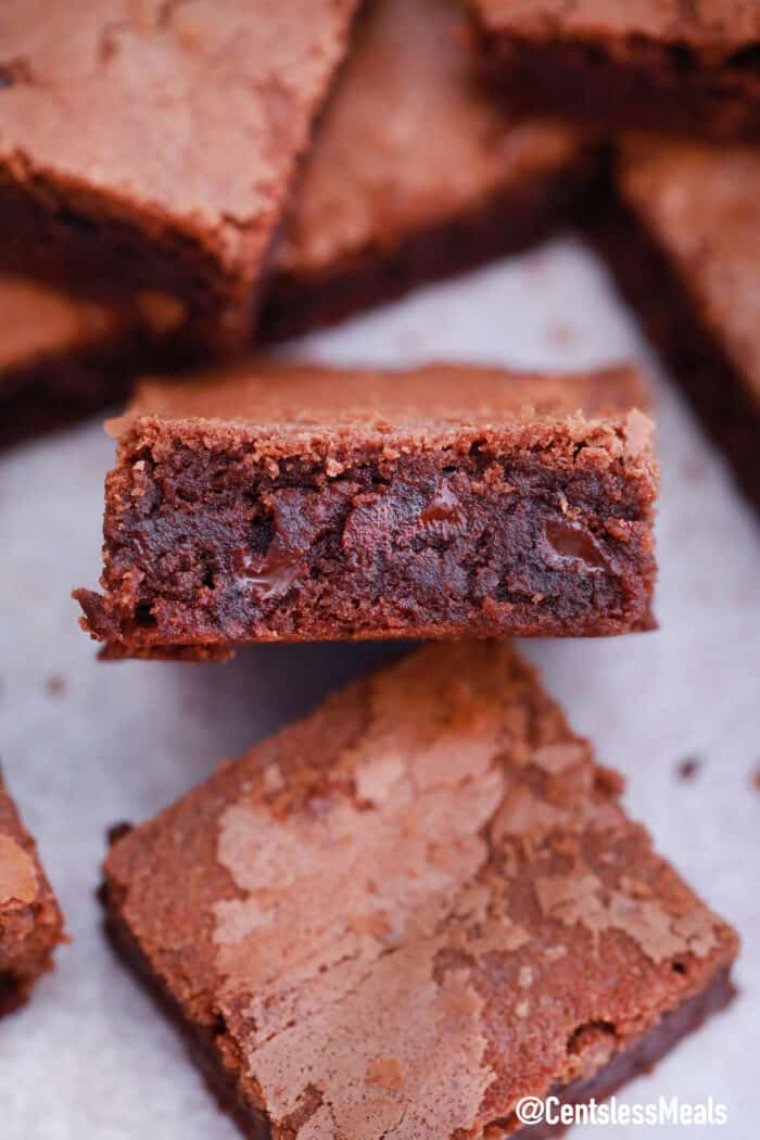 A Nutella brownie on it's side surrounded by other brownie squares.