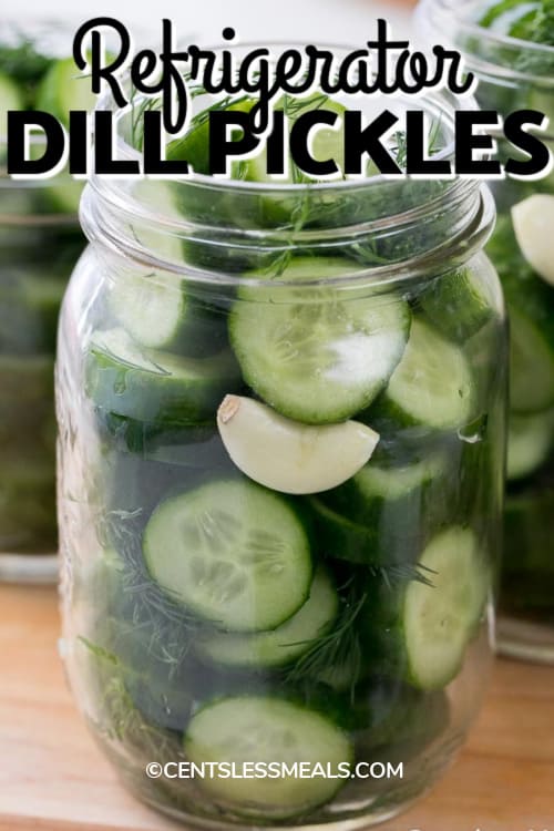 Refrigerator Dill pickles with cucumber garlic and dill in a mason jar with a title