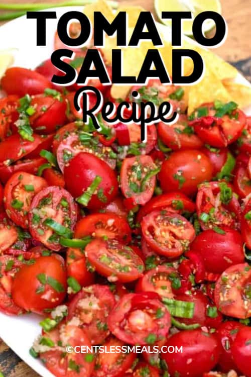 Cherry tomato salad on a white serving plate with a title.