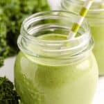 Green Smoothie in a glass with a straw