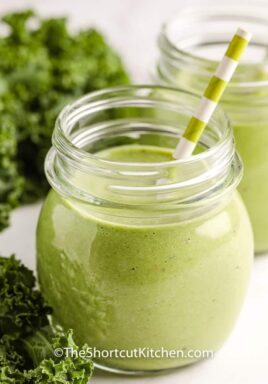 Green Smoothie in a glass with a straw
