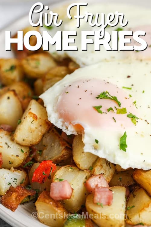 Air Fryer Home Fries topped with eggs on a white plate with writing