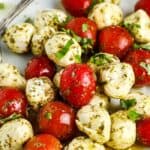 Pesto Caprese Salad on a white plate