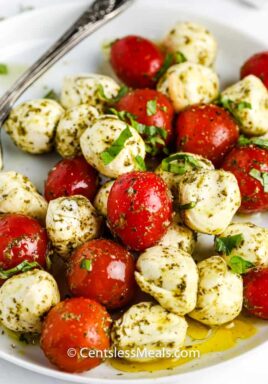 Pesto Caprese Salad on a white plate