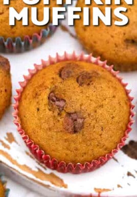 Pumpkin Muffins with chocolate chips on a board, with writing.
