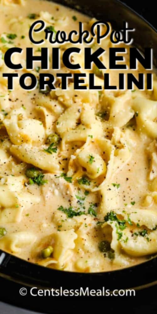 Crockpot Chicken Tortellini in a slow cooker after cooking, with a title.