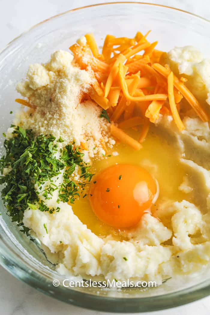 before mixing ingredients to make Loaded Mashed Potato Pancakes in a glass bowl