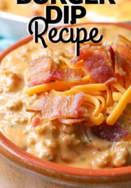 Bacon cheeseburger dip in a bowl with bacon and cheese on top with a title