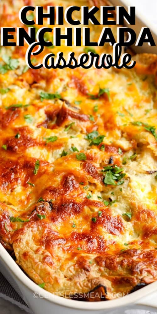 Chicken Enchilada Casserole in a white baking dish with writing