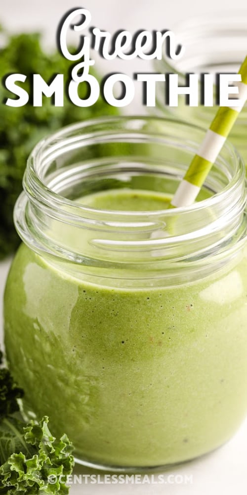 A Green Smoothie in a glass jar with a green and white striped straw with writing