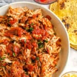 top view of ingredients to make Crock Pot Chicken Tacos in bowls