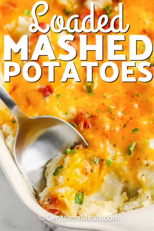 Loaded Mashed Potatoes with a spoon scooping a bite, with writing.