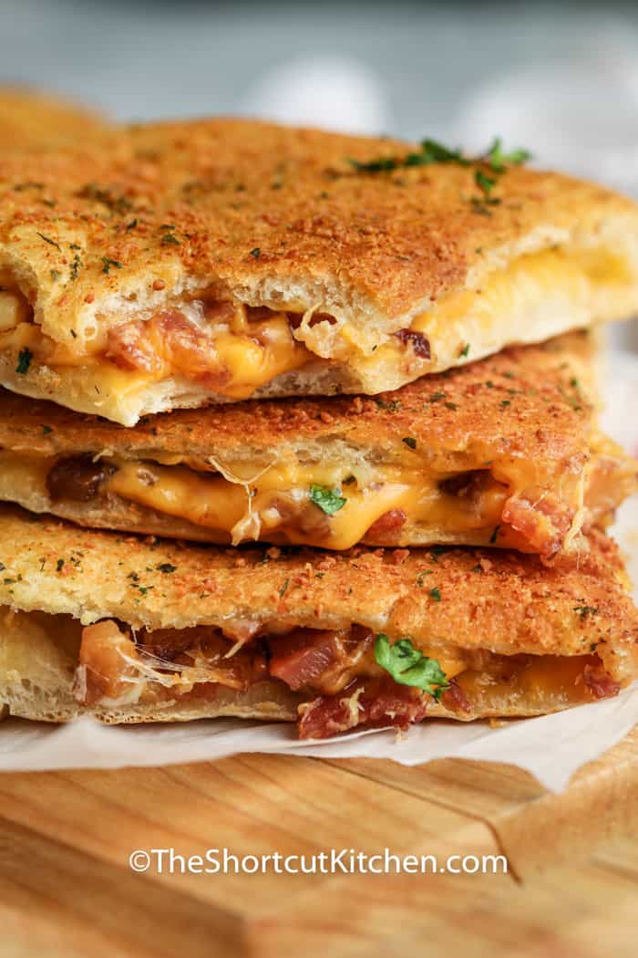 three Oven Baked Grilled Cheese sandwiches stacked