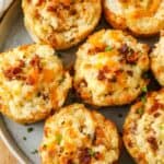 top view of cooked Loaded Mashed Potato Cups on a plate