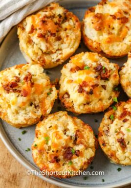 top view of cooked Loaded Mashed Potato Cups on a plate