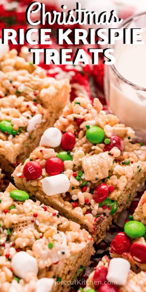 close up of Christmas Rice Krispie Treats with a glass of milk and writing