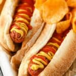 Air Fryer Hot Dogs plated with chips