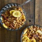 top view of Banana Bread Granola in a bowl with a spoon