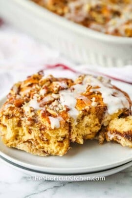 close up of a piece of Cinnamon Roll French Toast Casserole on a plate