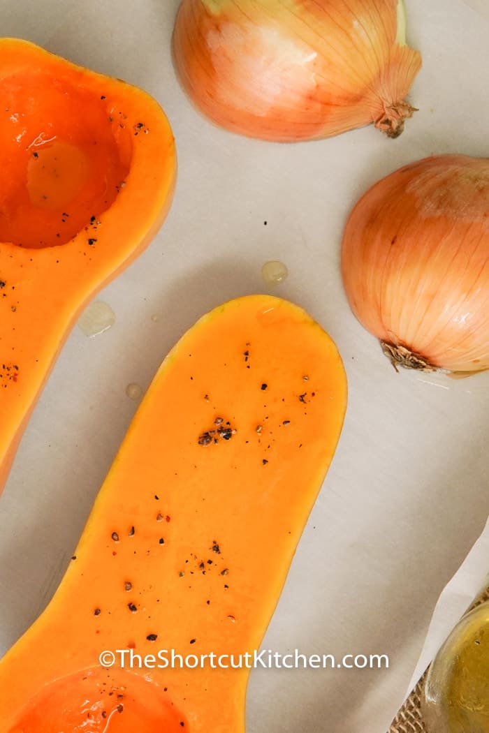 oil on squash and onions to make Creamy Butternut Squash Soup