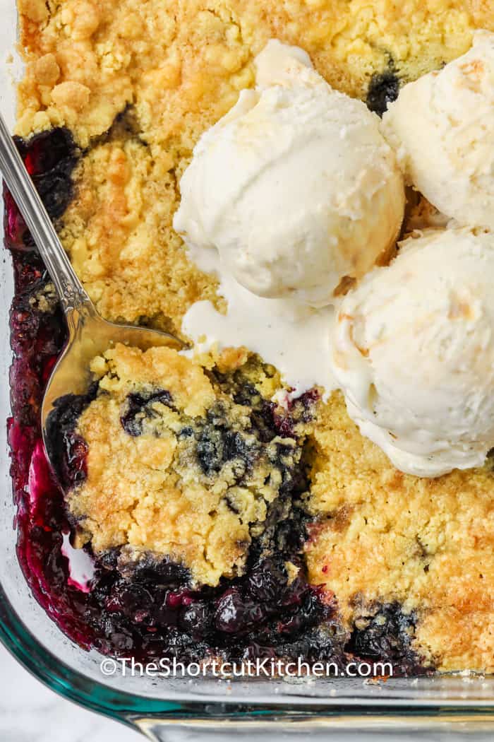 top view of cooked Lemon Blueberry Dump Cake in a casserole dish