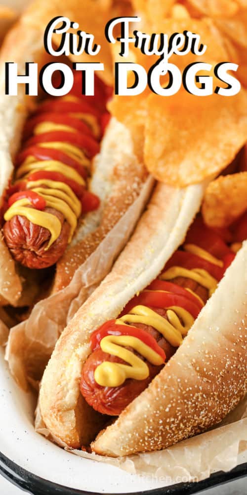 close up of air fryer baked hot dogs with a title