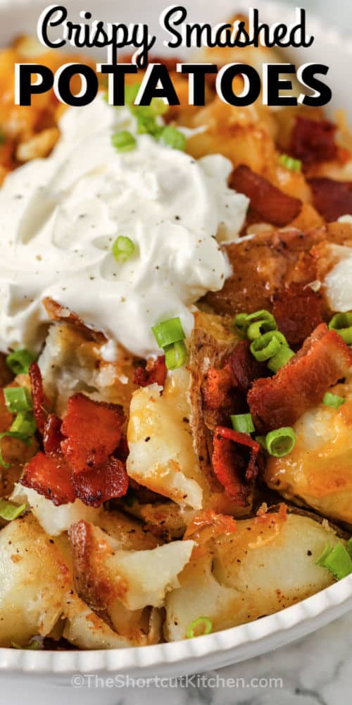 plated Crispy Smashed Potatoes with sour cream and a title