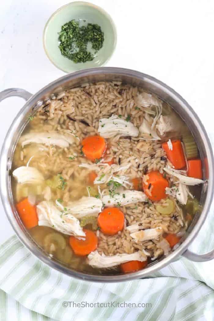 A stock pot full of Chicken Rice Soup