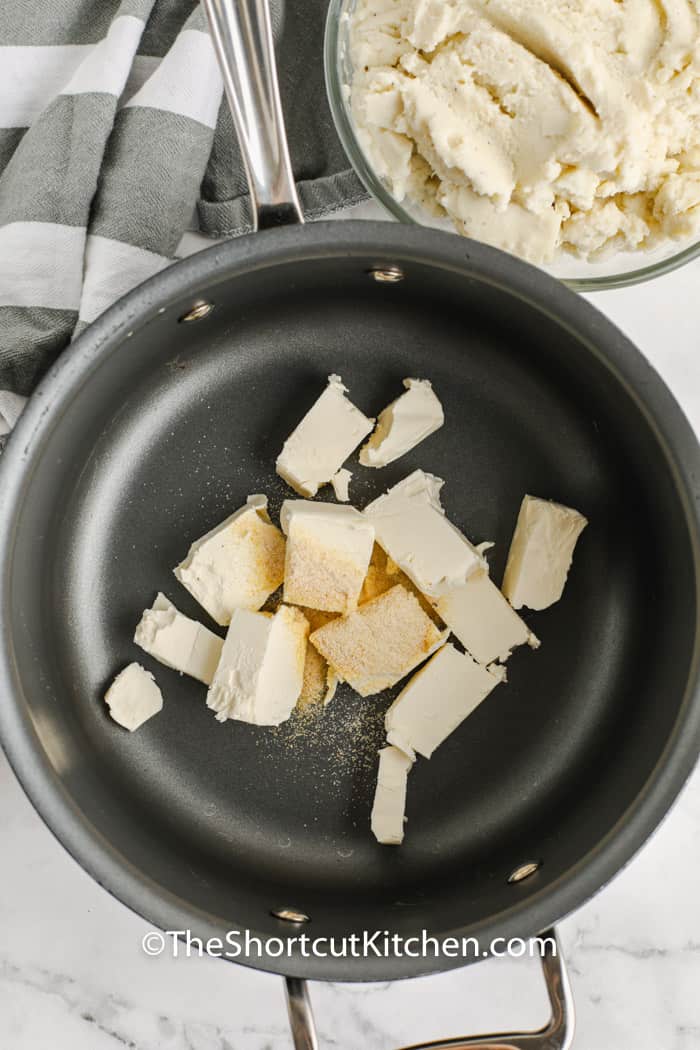 adding butter and seasonings to pan to make Creamy Potato Soup