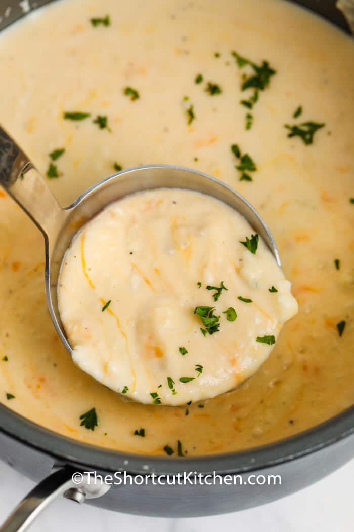 Creamy Potato Soup in the pot with a laddle