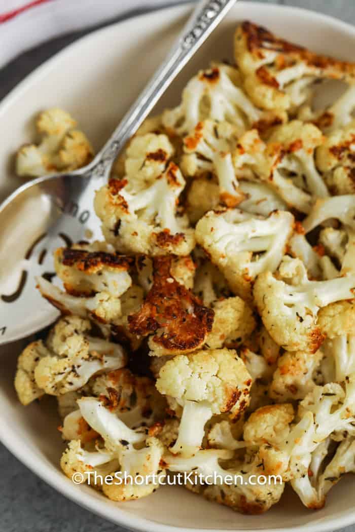 plated Roasted Cauliflower with a spoon
