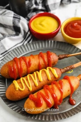 Air Fryer Frozen Corn Dogs on a plate with ketchup and mustard