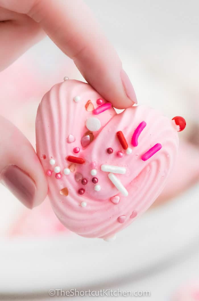 close up of holding a Heart Meringues
