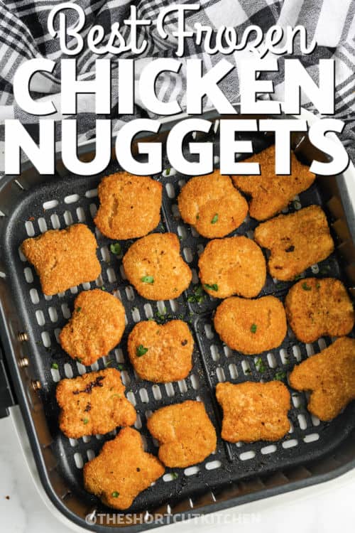 Air Fryer Frozen Chicken Nuggets cooked in the air fryer with writing