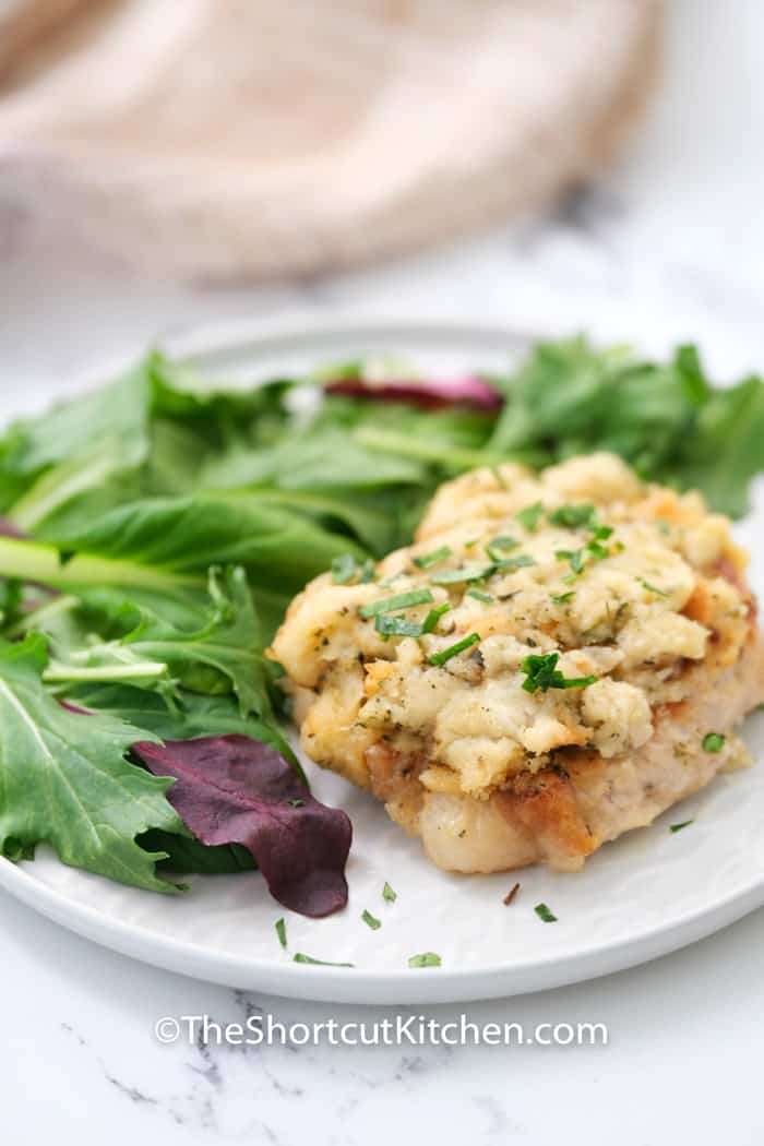 plated Smothered Pork Chops with salad