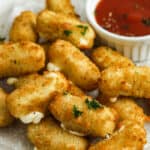 Air Fryer Frozen Mozzarella Sticks on a plate