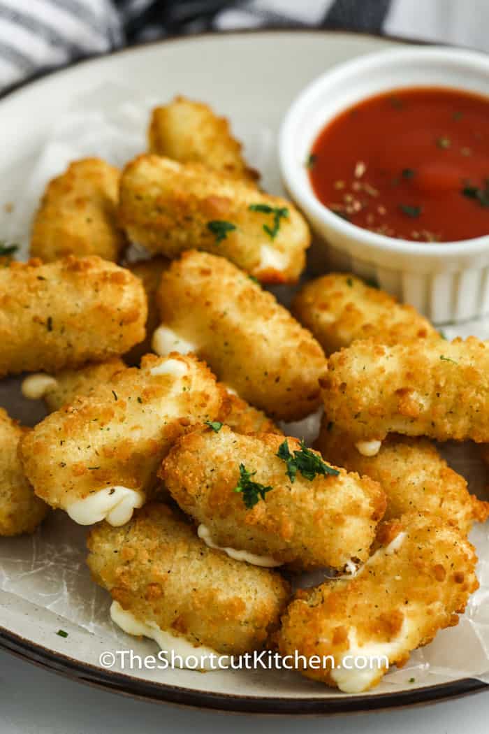 Air Fryer Frozen Mozzarella Sticks on a plate