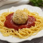 Chicken Parmesan Meatballs on spaghetti