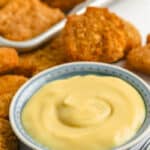 Quick Honey Mustard Sauce Recipe in a dish with chicken nuggets