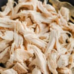 Easy Shredded Chicken in a pan with a fork